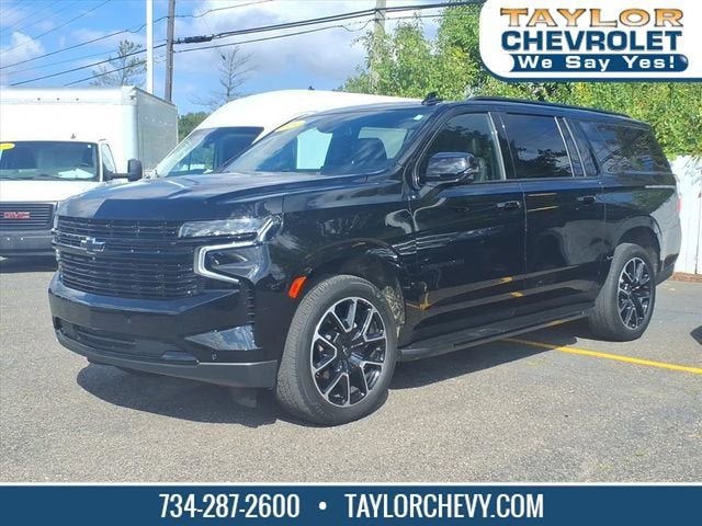 2024 Chevrolet Suburban RST in Black — front three-quarter view