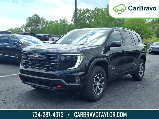 2024 GMC Acadia AT4 in Ebony Twilight Metallic — front three-quarter view