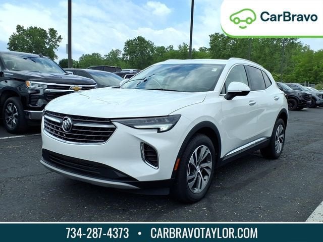2023 Buick Envision Essence in Summit White — front three-quarter view